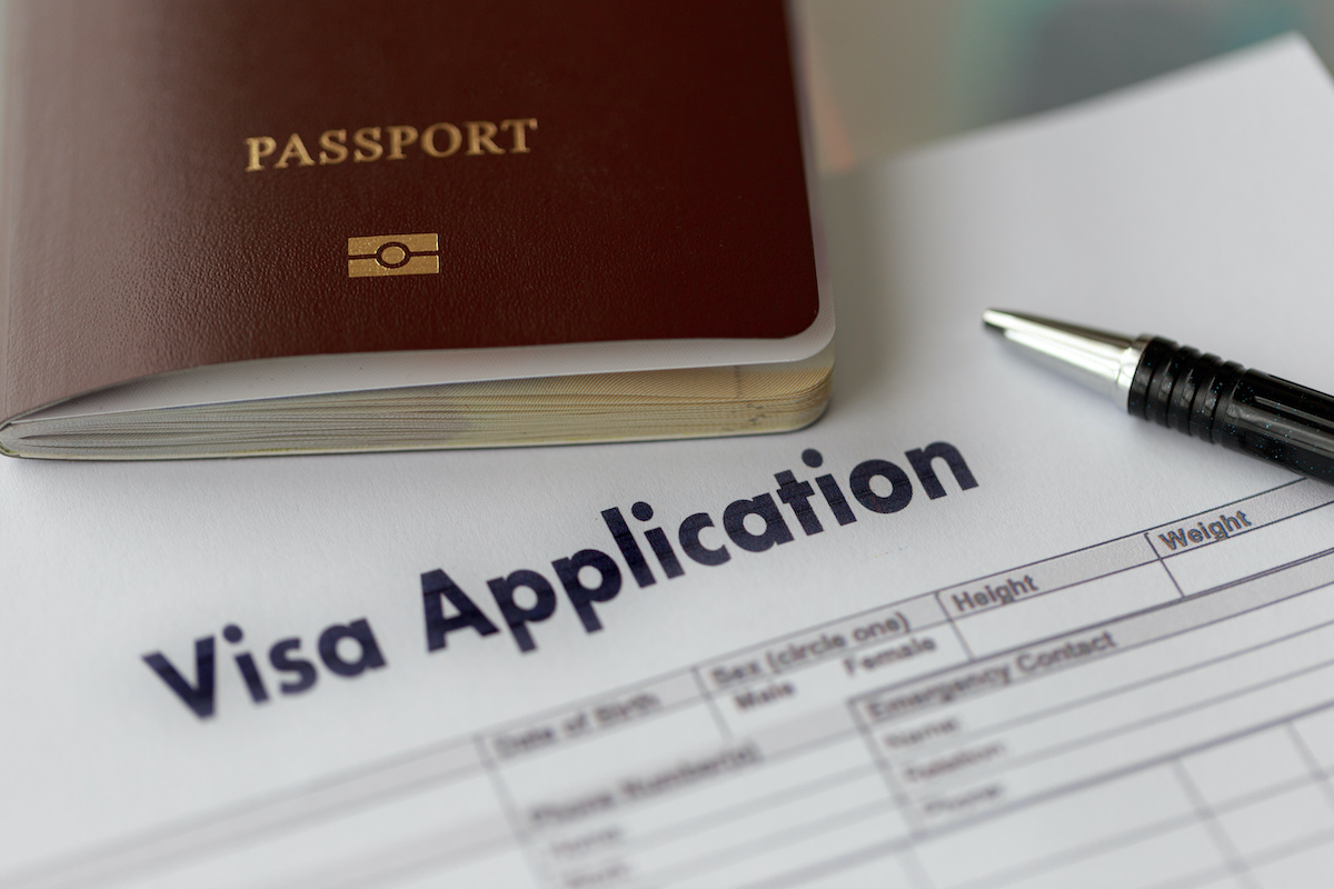 Stock photo of a passport and a visa application