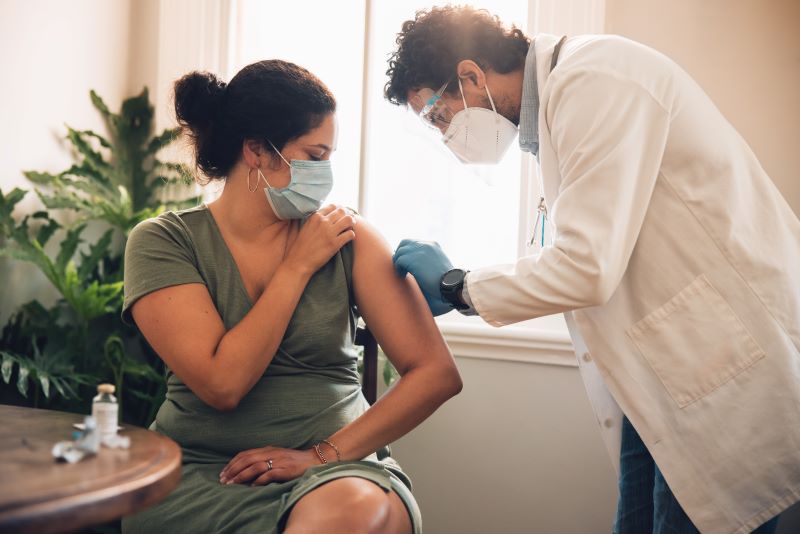 An image of someone getting a covid-19 vaccine.