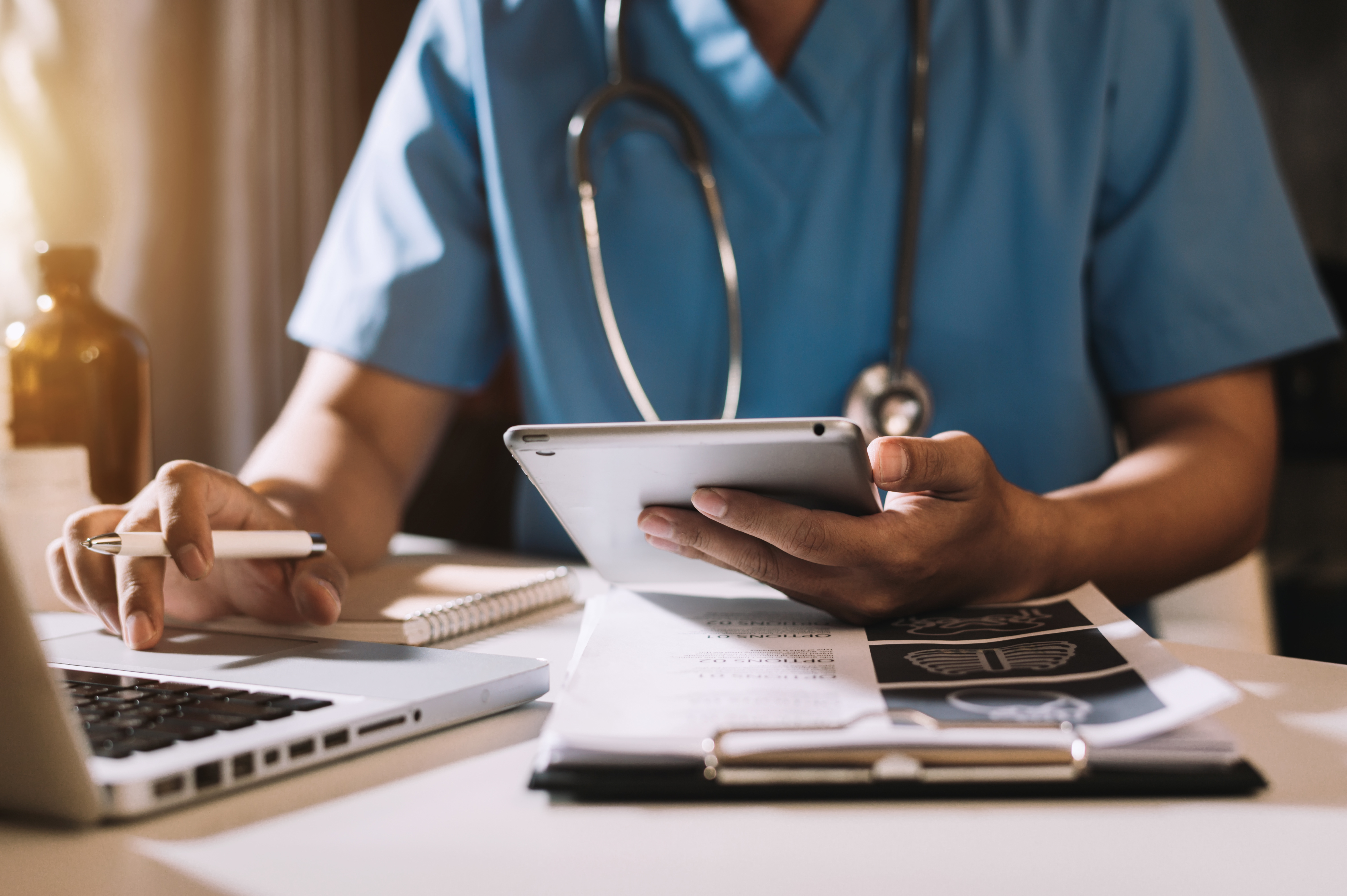 doctor with computer and calculator