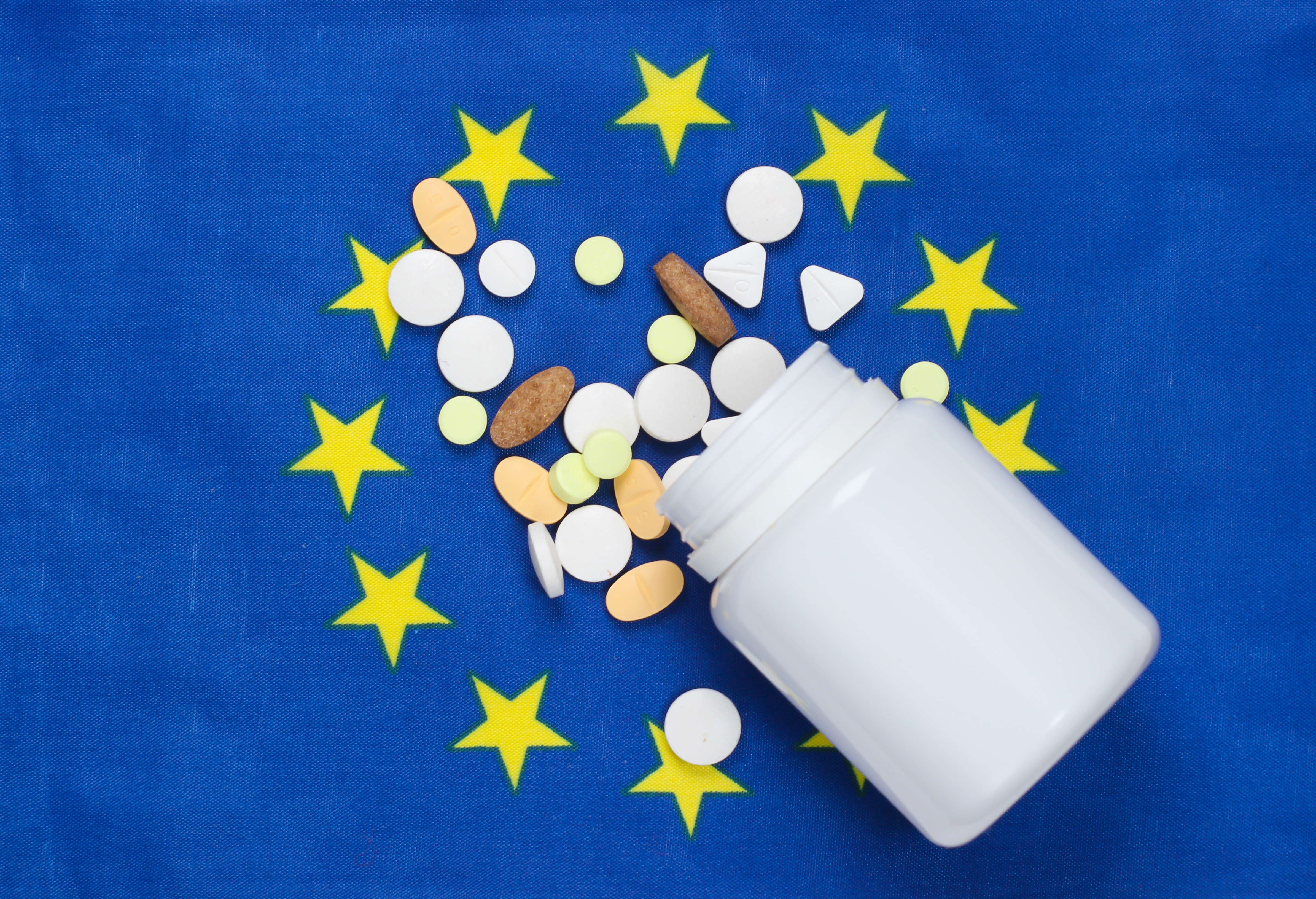 antibiotic pills on EU flag