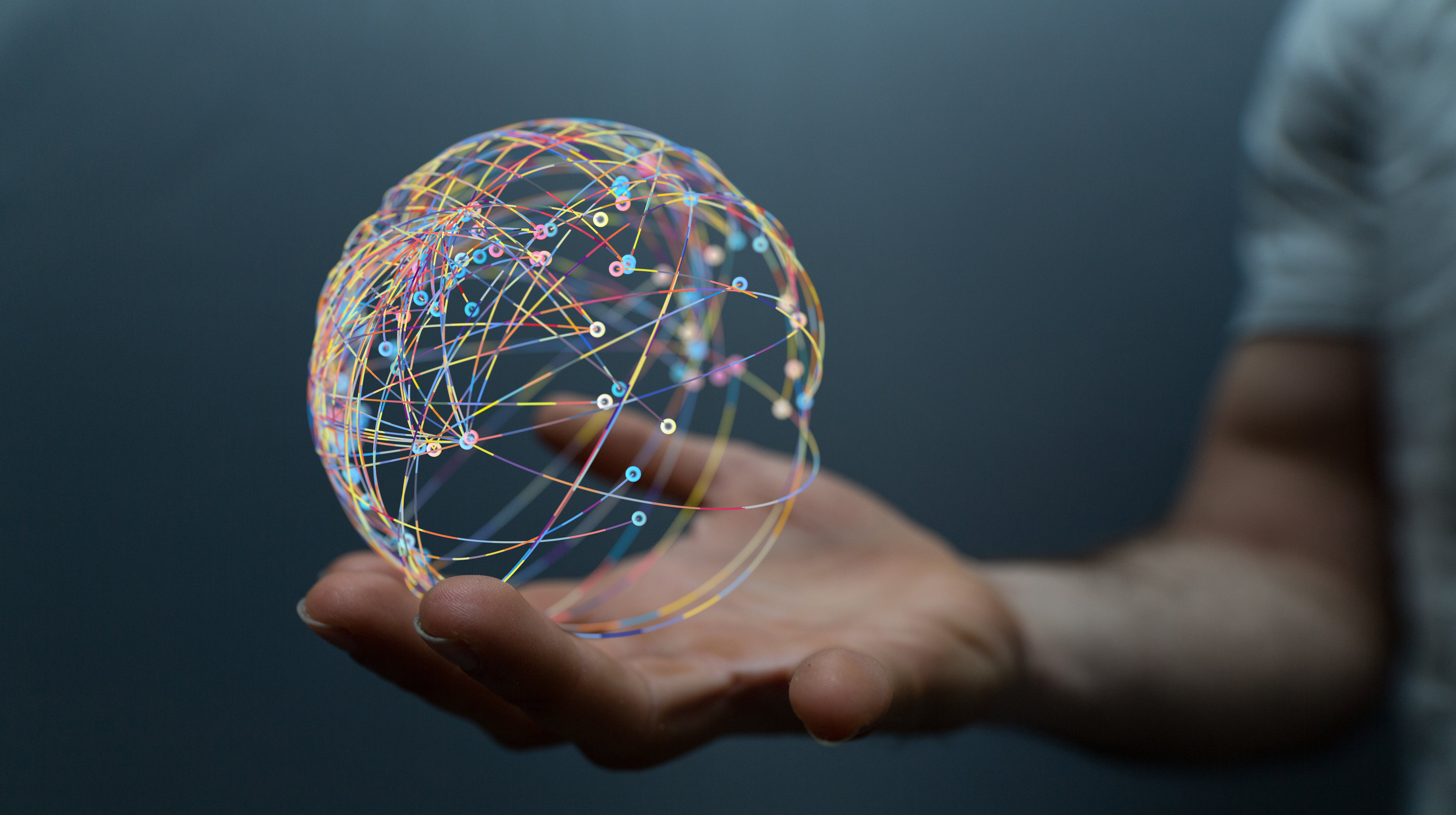 hand holding globe of lights