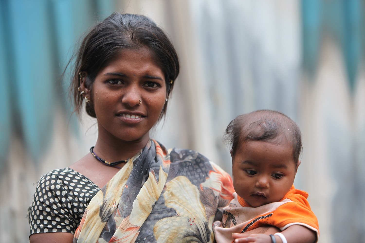 Image of young woman holding baby