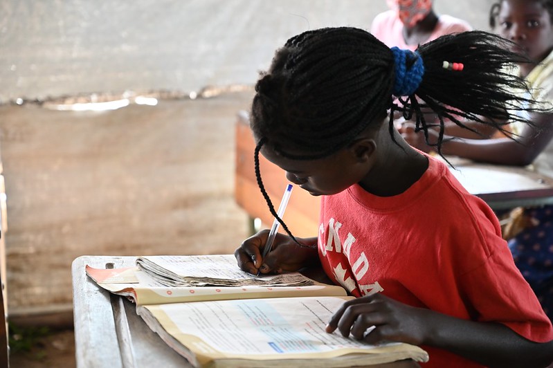 School girl in Mozambique at desk with class work