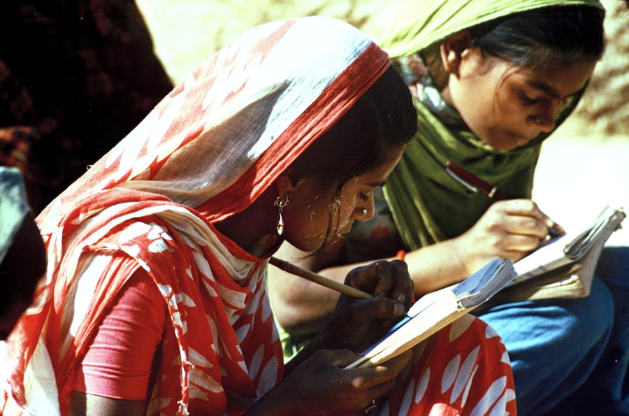 two young women in adult literacy class in India