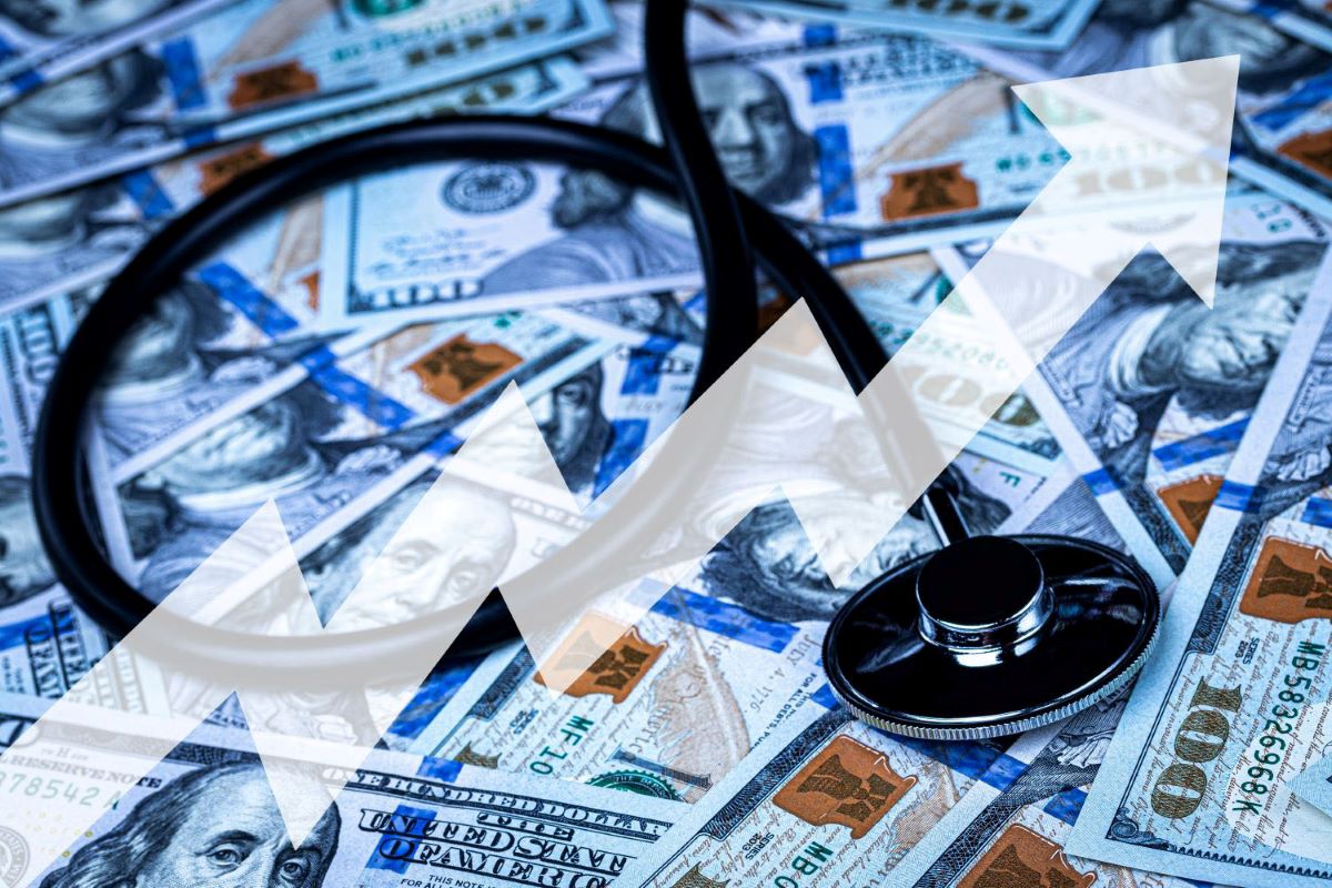 Stethoscope on the background of one hundred dollar bills.