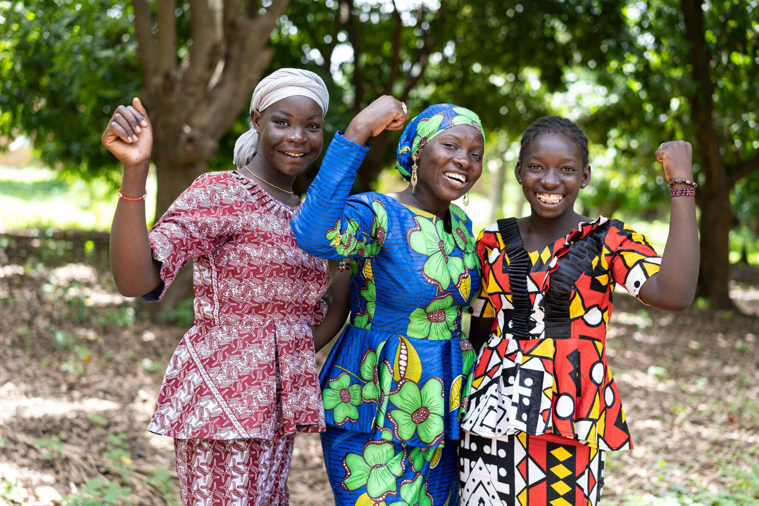 Group of young women African villagers in colourful traditional