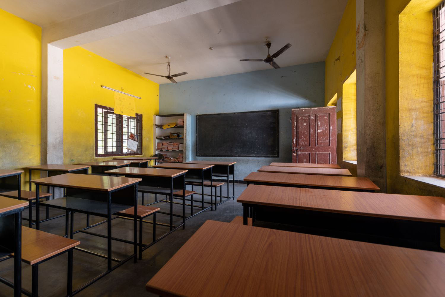 Empty classroom with desks in school classroom