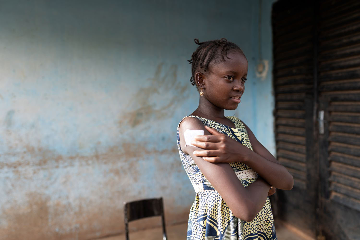 girl with a relieved expression after receving her first COVID vaccine shot