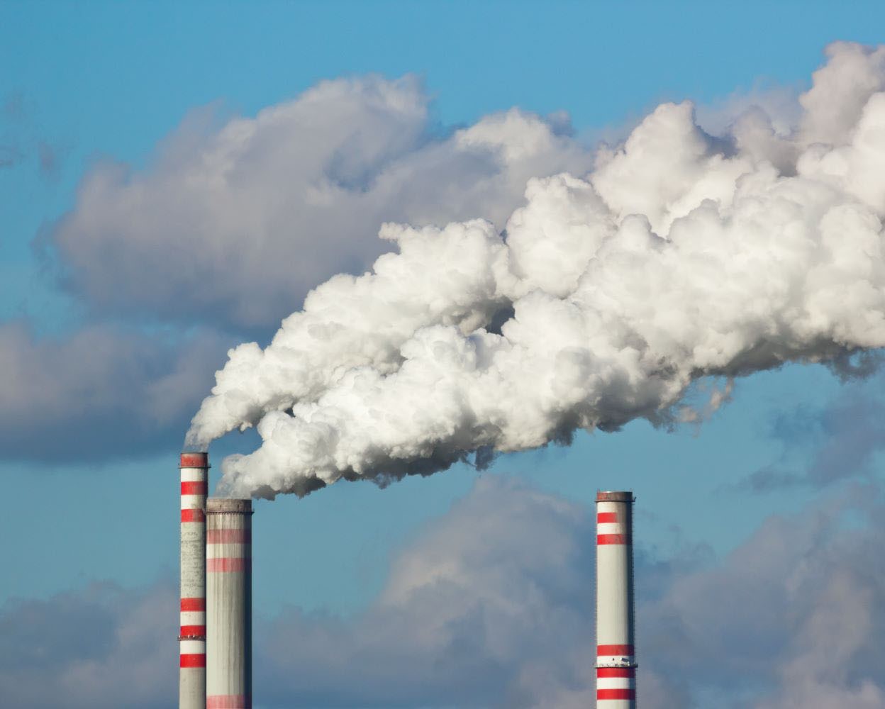 Factory chimneys blowing out smoke