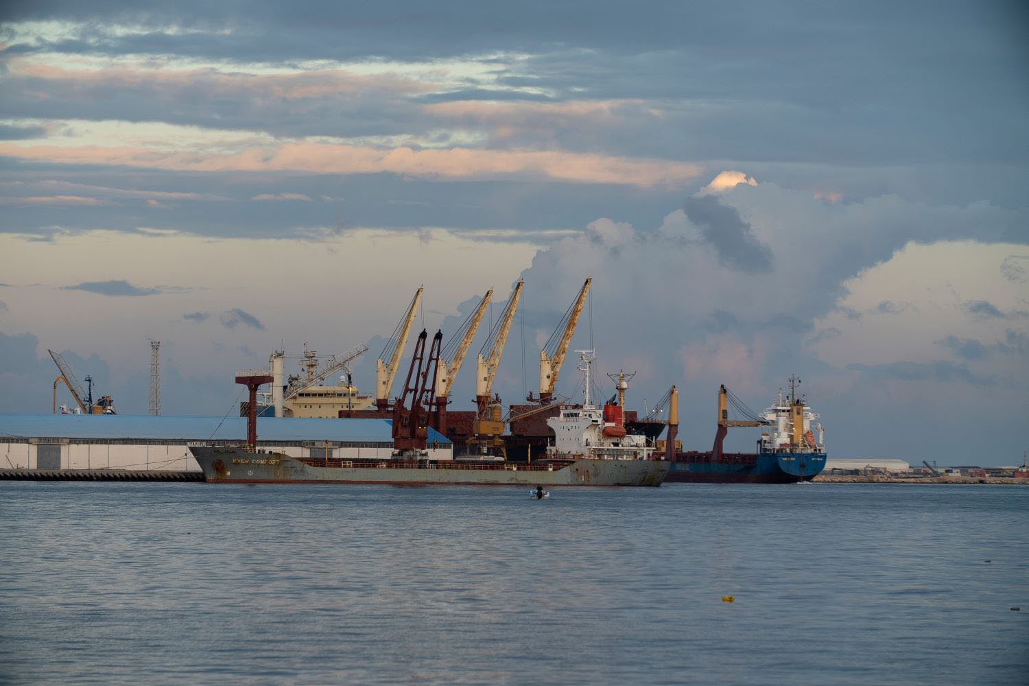 Tripoli, Libya - November 25, 2020: Container ships with loading cranes in the Port of Tripoli