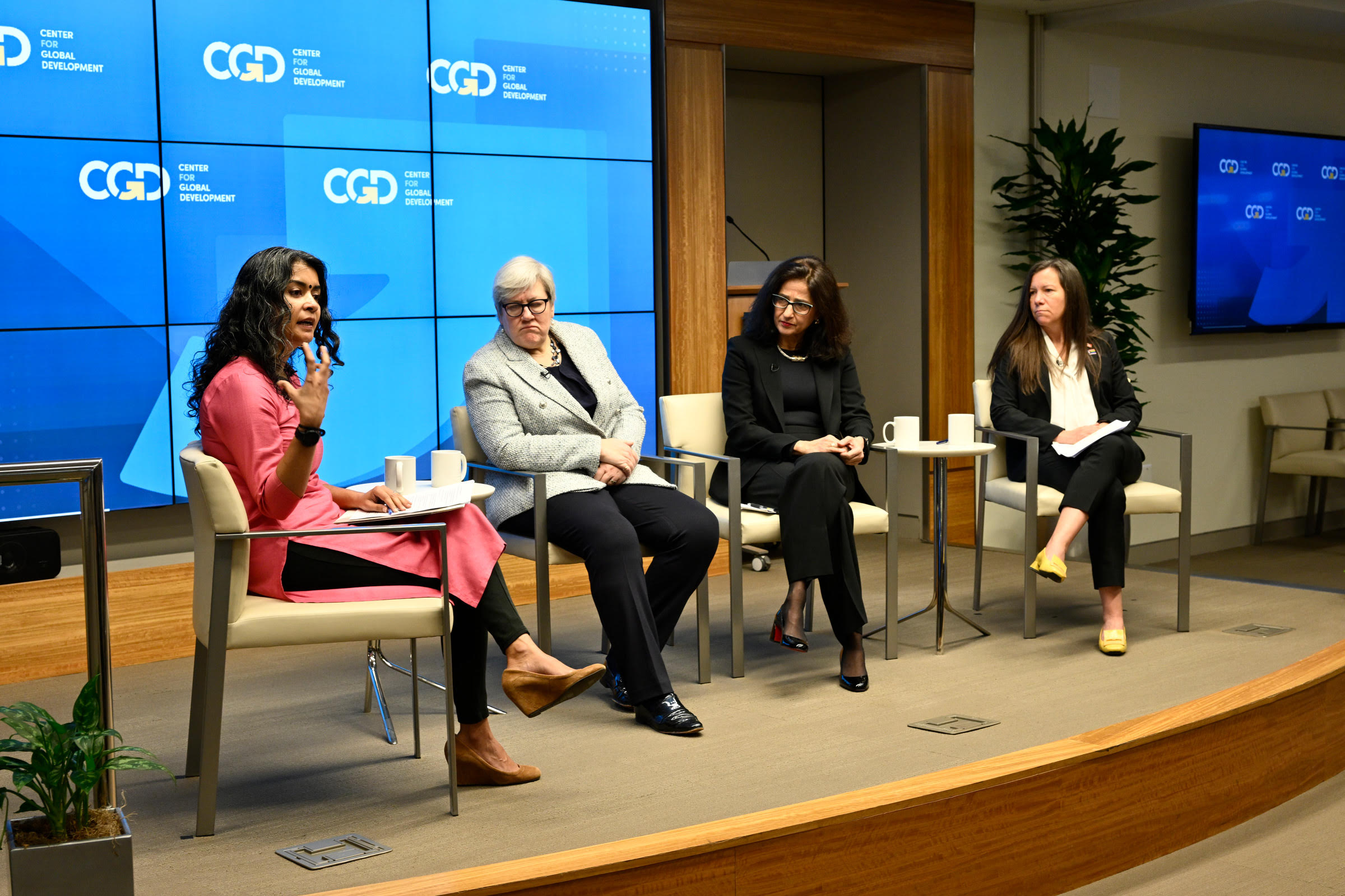 Four women speakers on stage