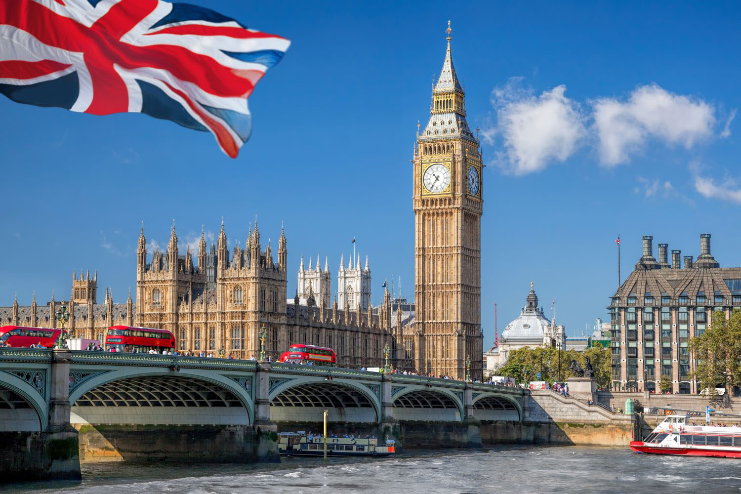 Big Ben and Houses of Parliament with boat in London, England, UK