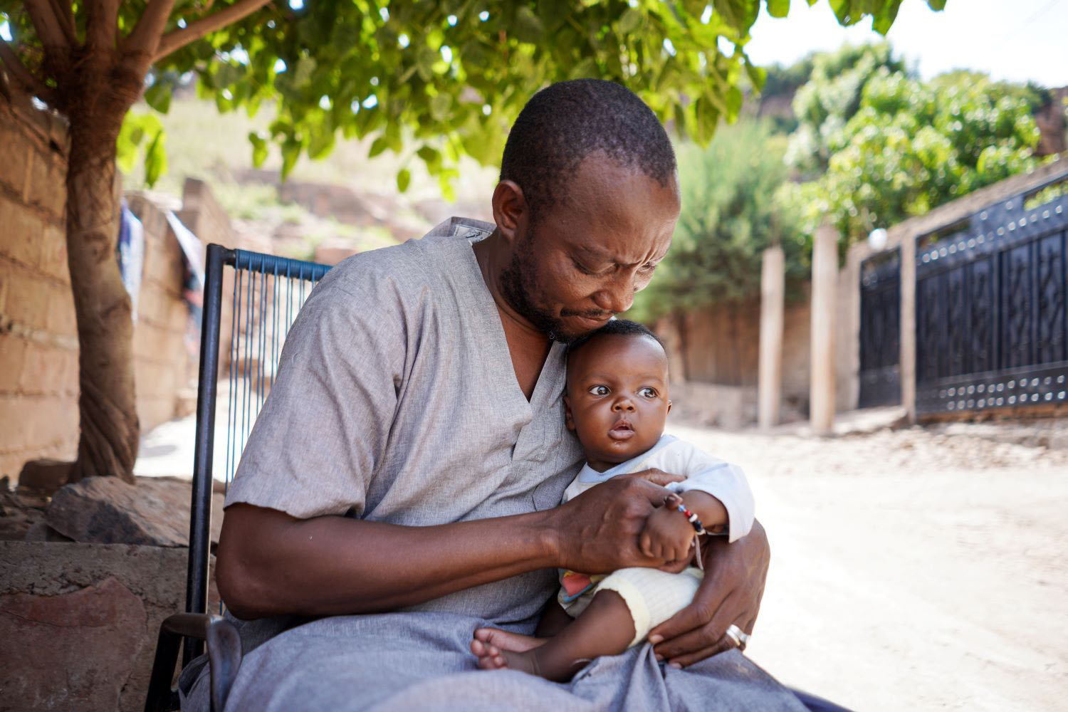 Father holds his child in hands