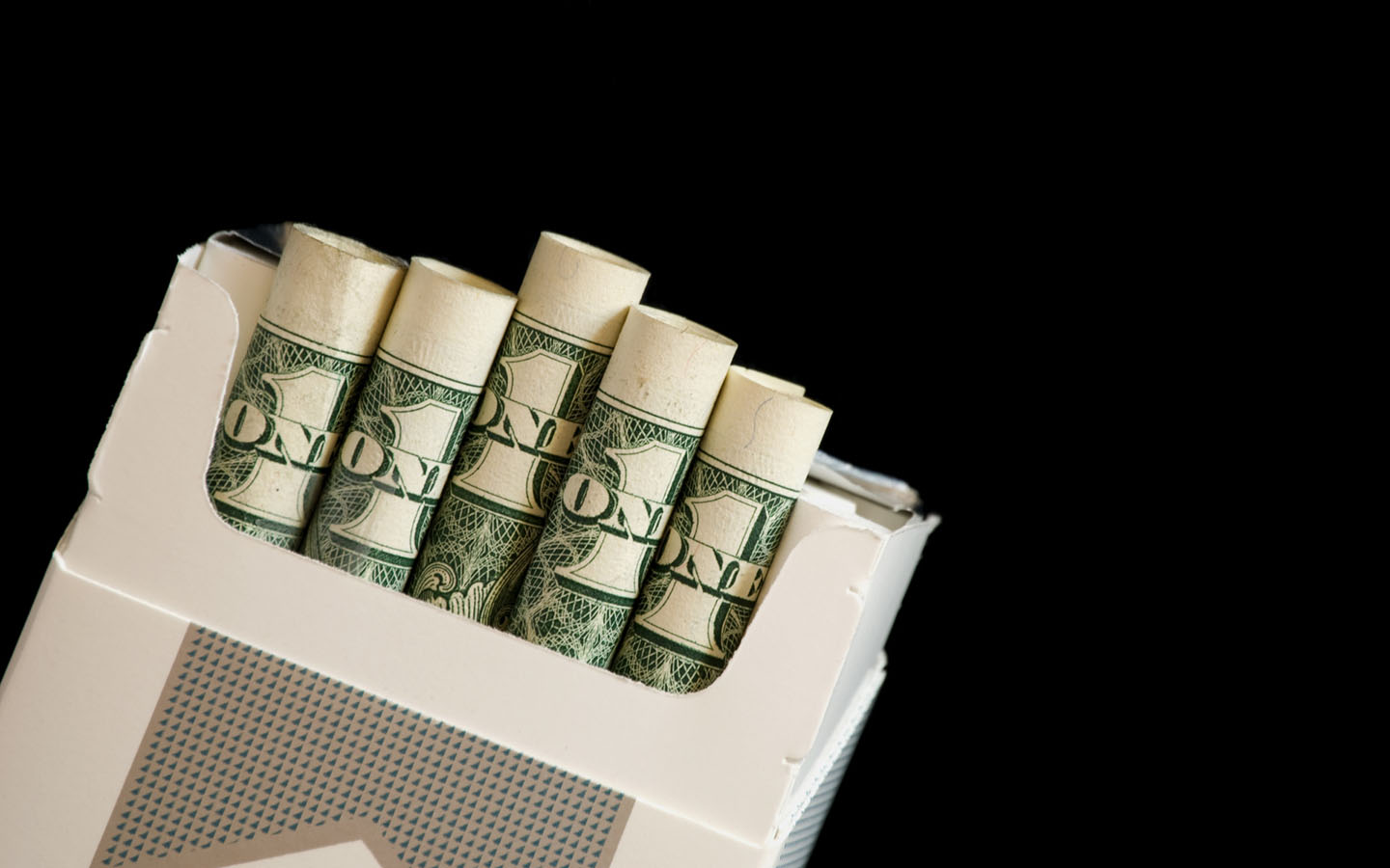 Money rolled in a cigarettes box