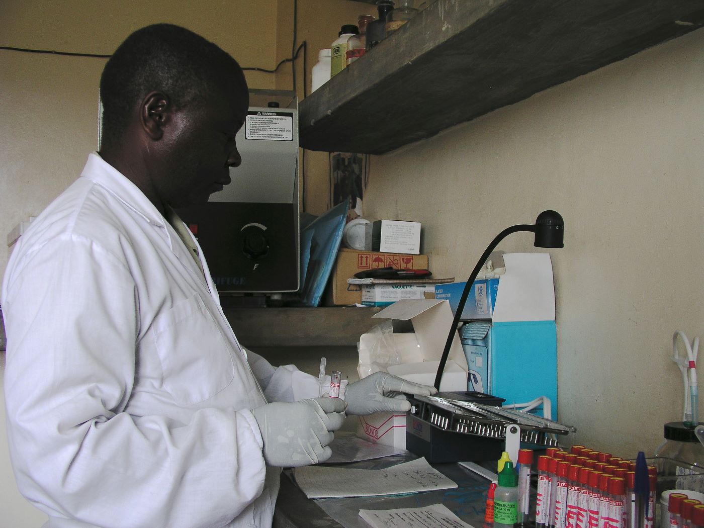 Doctor in Uganda running blood tests