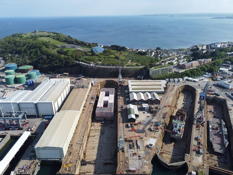 Barge under repair in falmouth harbour aerial drone