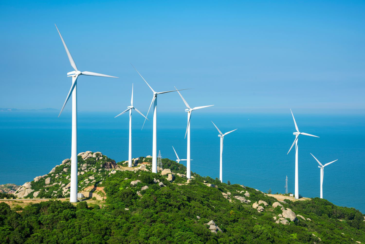 Wind turbines in the mountains near the sea