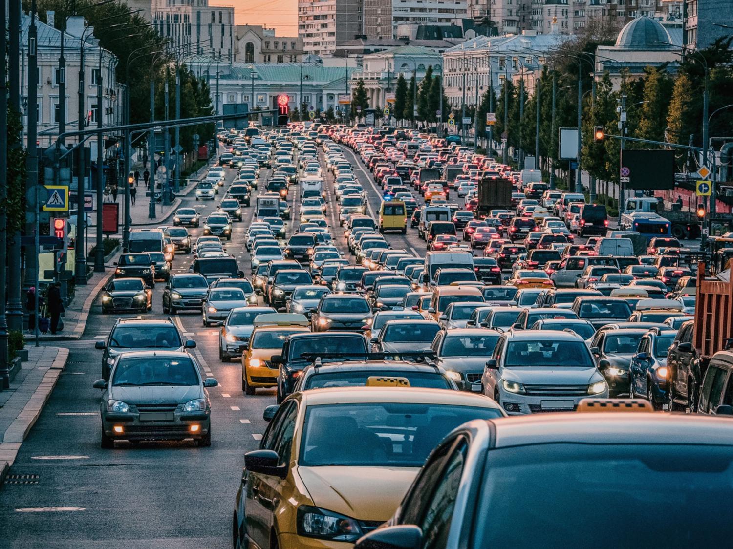 Cars stands in traffic jam in the city center in the evening