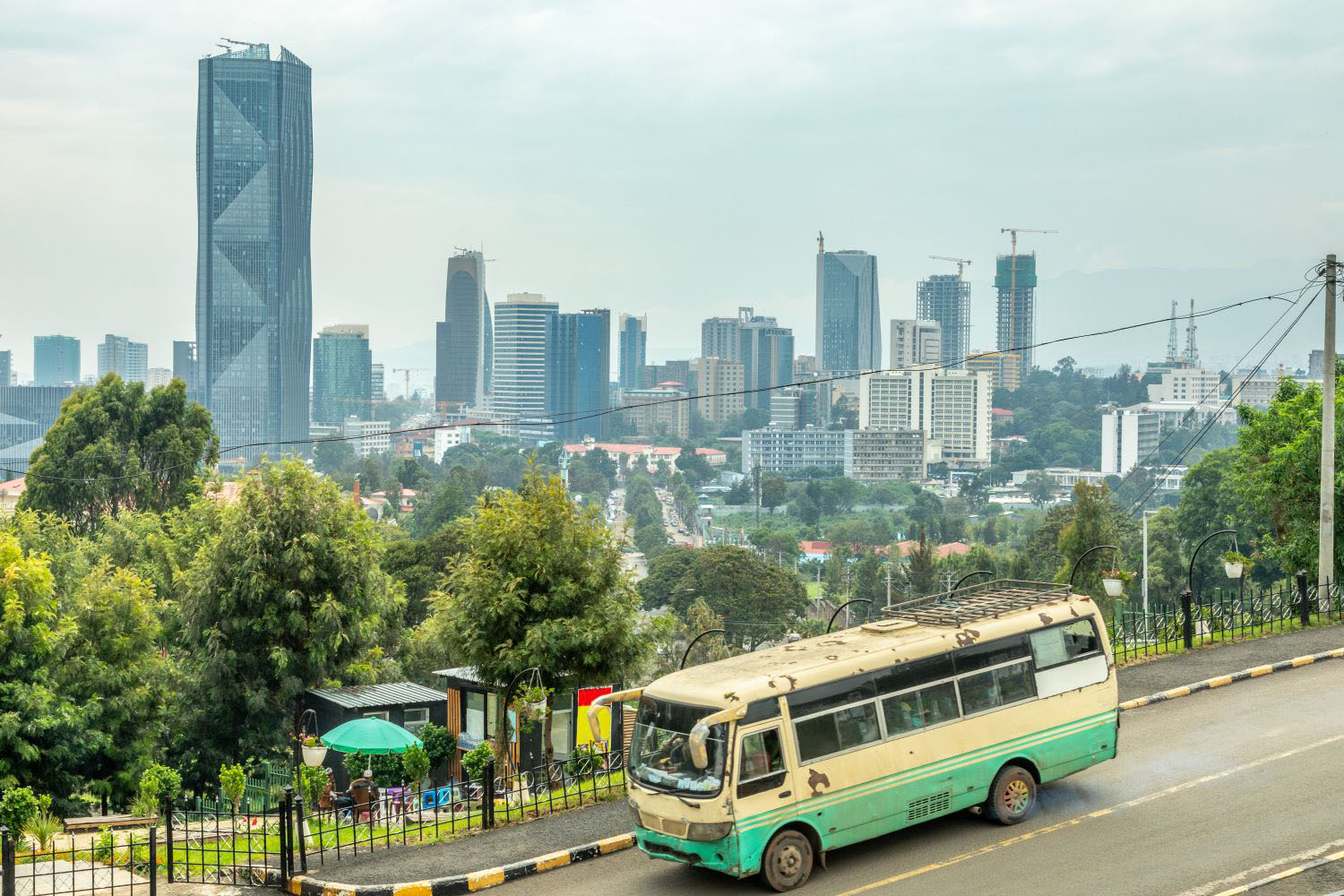Financial district with modern downtown skyscrapers and passenger bus on the road, Addis Ababa, Ethiopia.