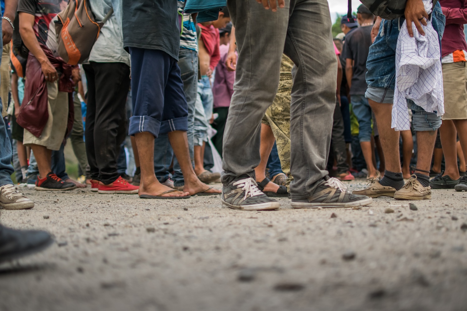 image of tattered clothes and shoes of Honduran migrants