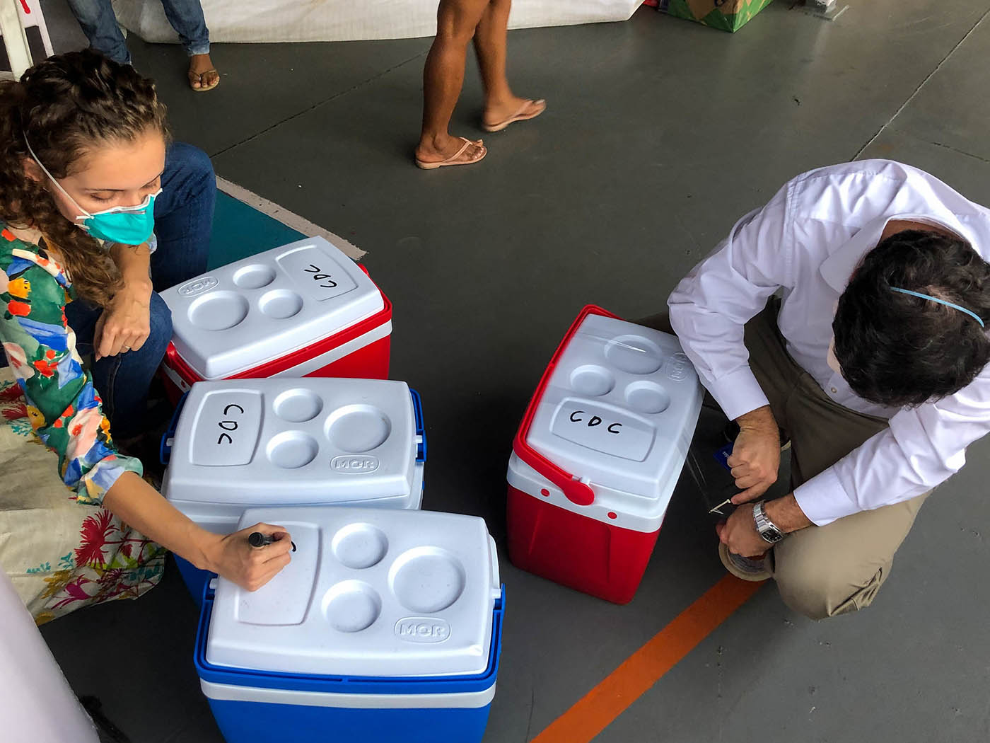 A US CDC team in Brazil prepares supplies to be shipped to a remote community in the Amazon rain forest.