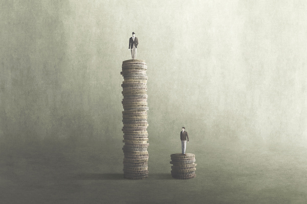 one person standing on a vary tall pile of coins, a second one standing on a small pile of coins