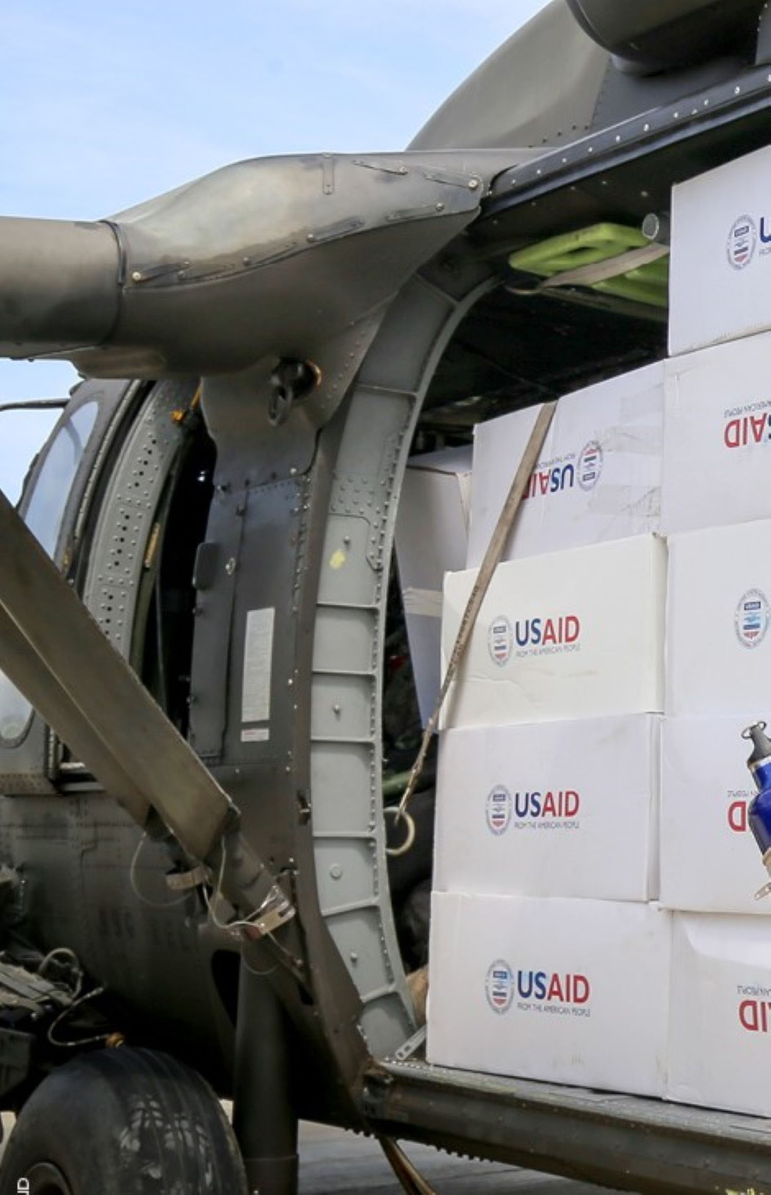 USAID supplies in a helicopter 