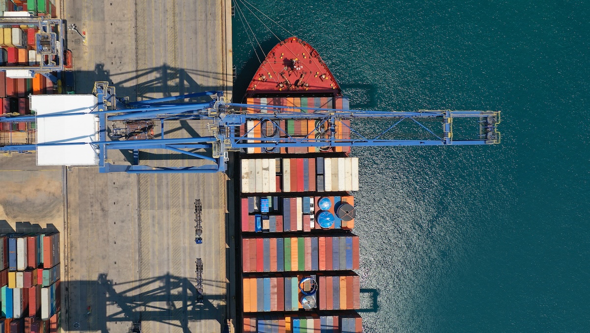 Container ship being loaded up at a port