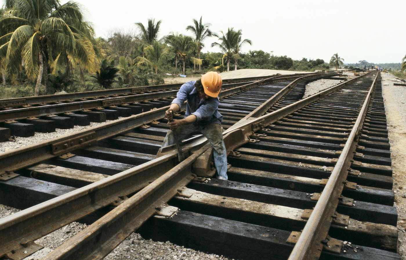 A man fixing a railroad track