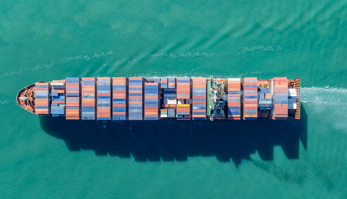 An overhead photo of a cargo ship at sea