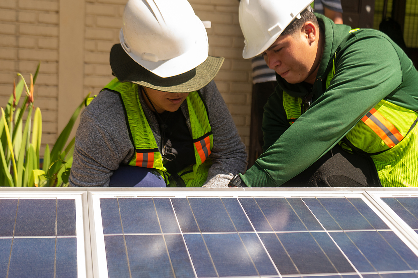 Solar technicians installing panels