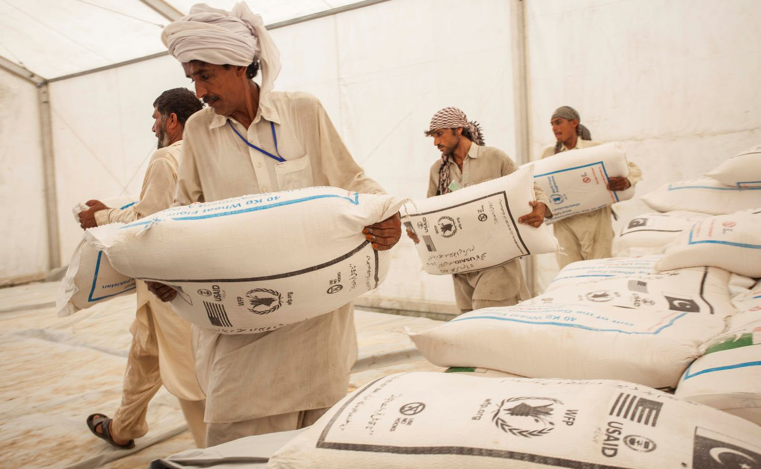 Helping Hands Distribute Food