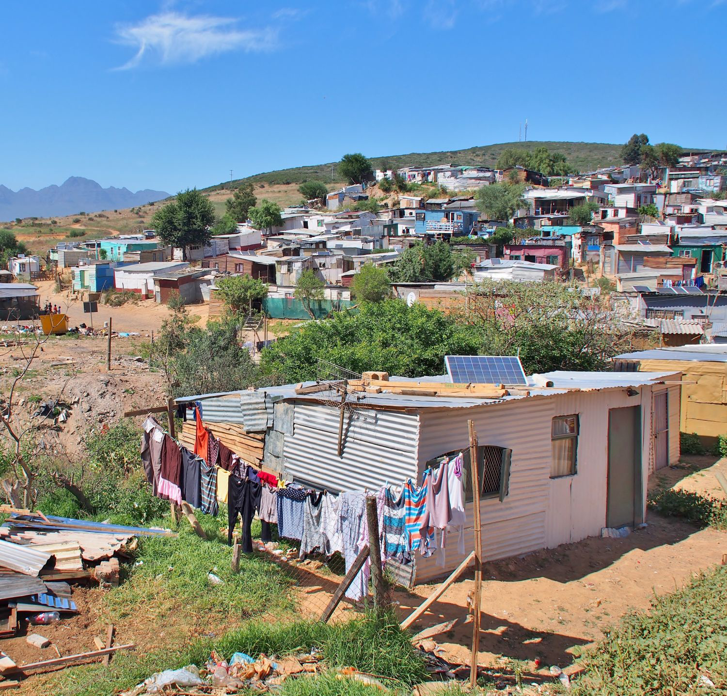 Shack in Cape province, South Africa with solar panels on roof.