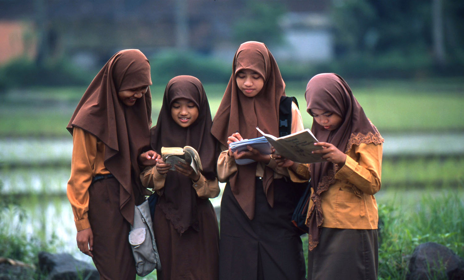 Indonesian school children reading books