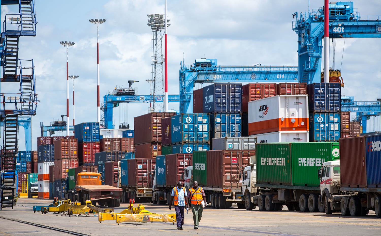 Shipping containers and dock workers at Port of Mombasa, Kenya