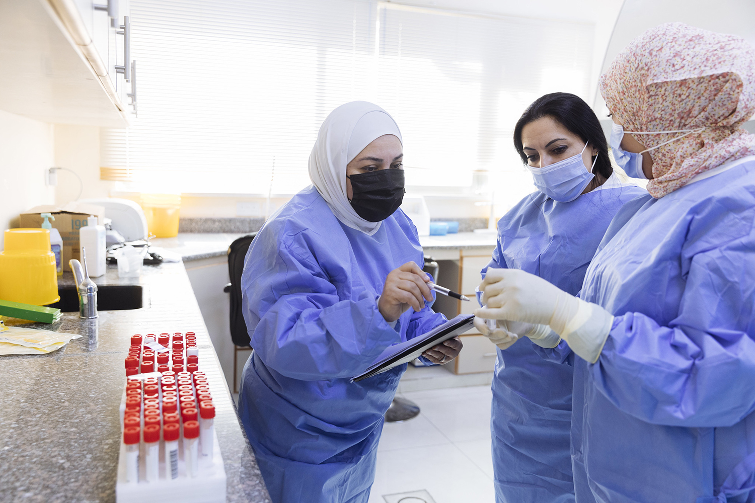 Laboratory technicians at a COVID testing facility in Jordan