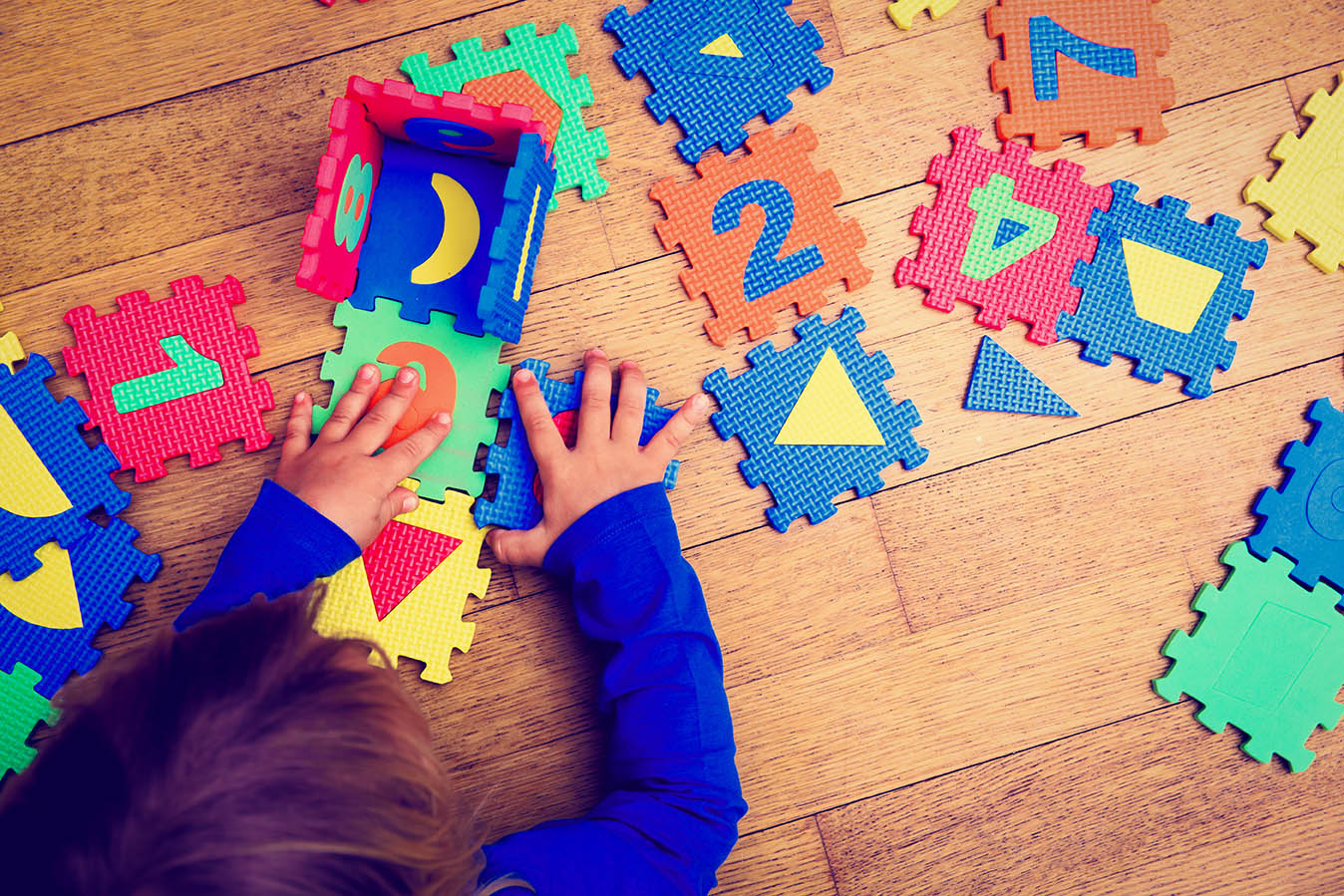 Young child playing with puzzle