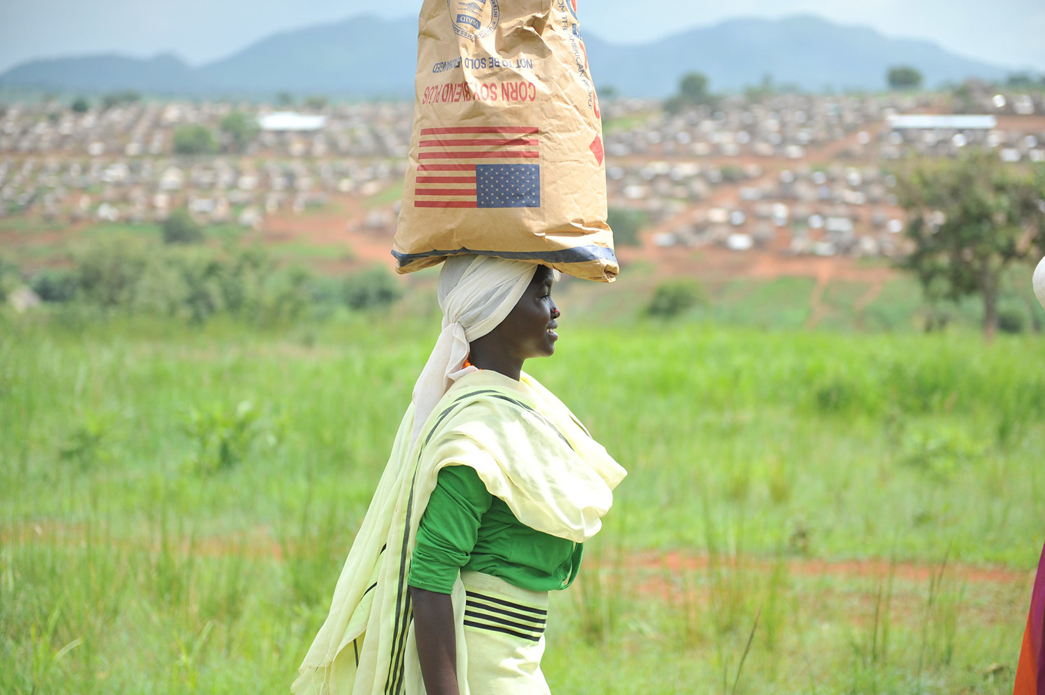 Woman receiving USAID commodities at Bambasi refugee camp, Ethiopia