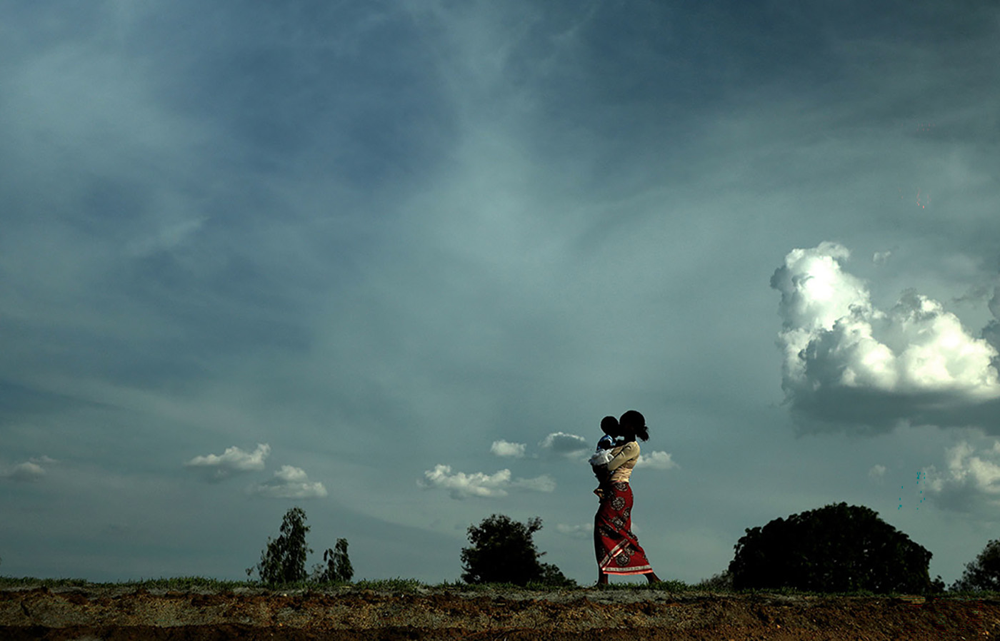 Woman and child in field in Malawi