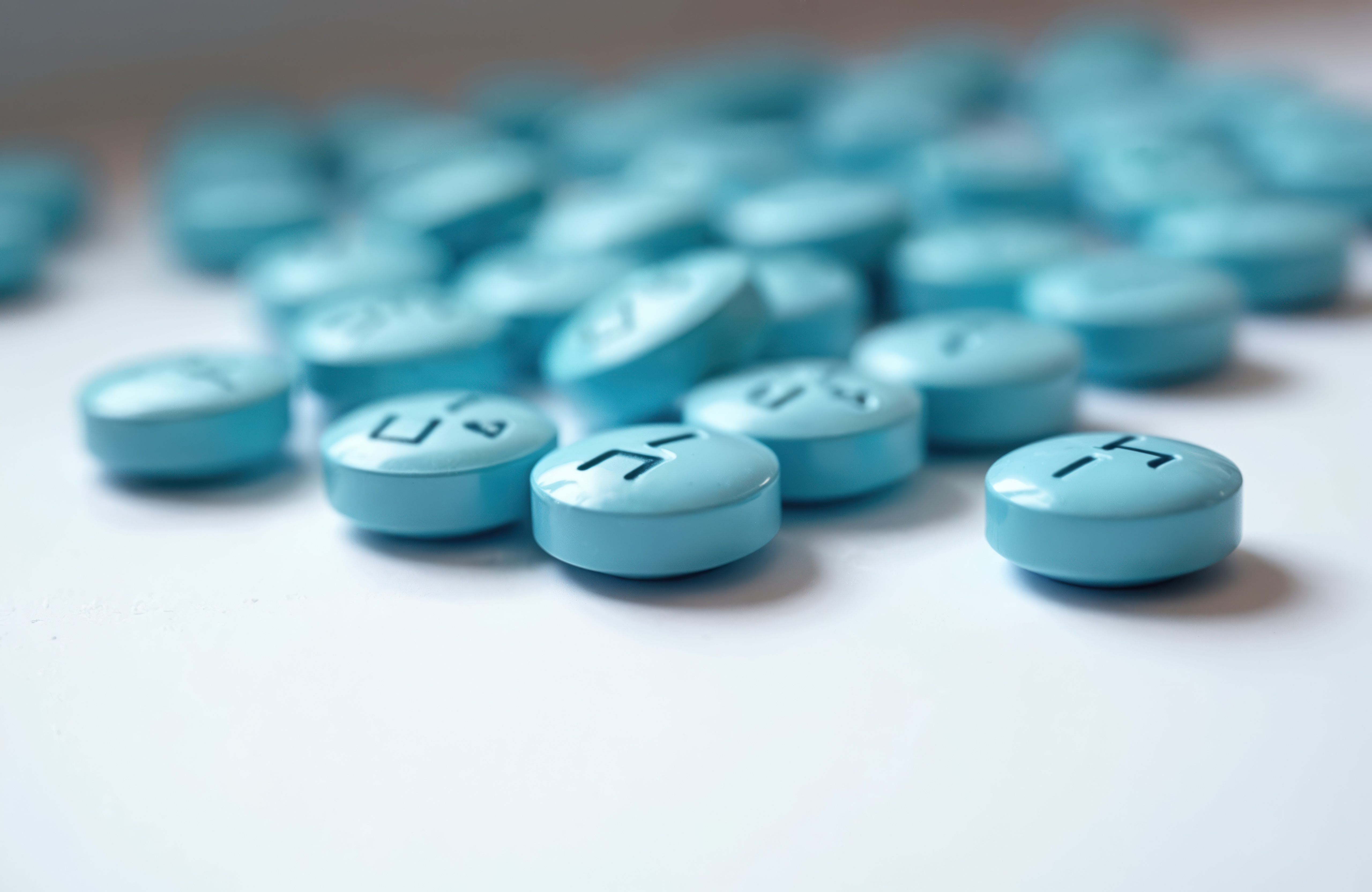 Close-up of blue pills, pre-exposure prophylaxis treatment against HIV.