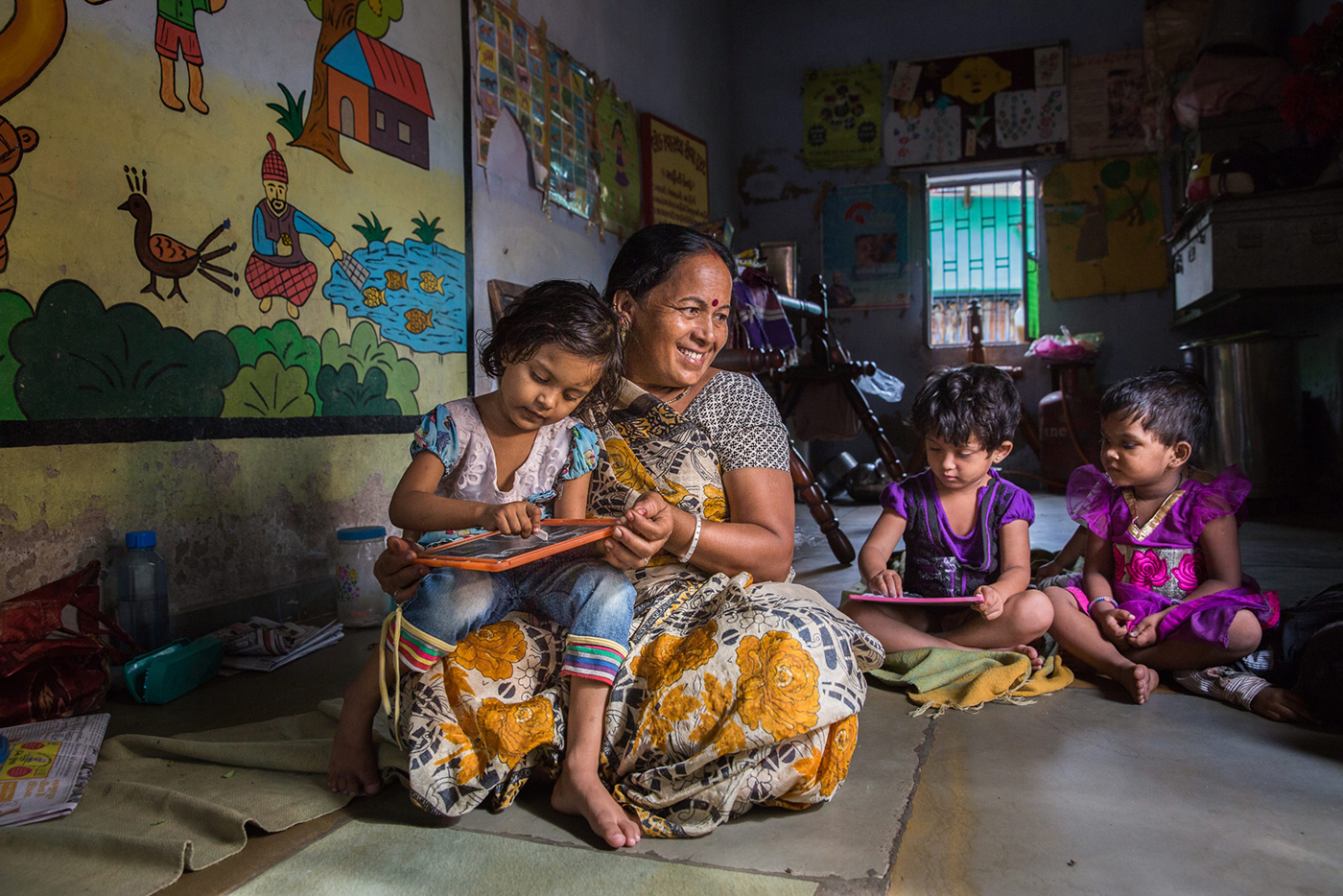Teacher with child at BALSEWA daycare in Gujarat, India