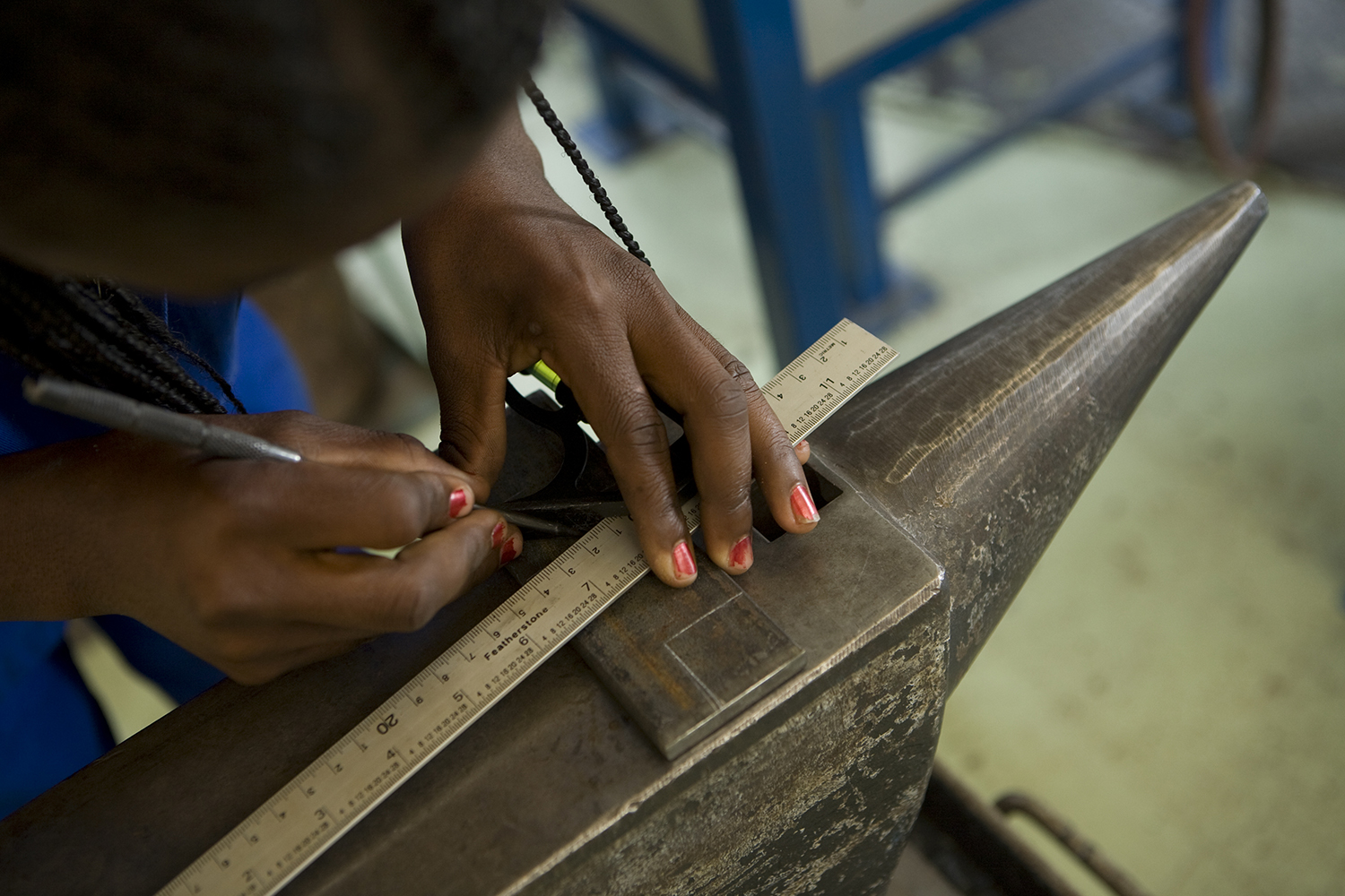 Girl learning metal working at Windhoek Youth Vocational Training Centre
