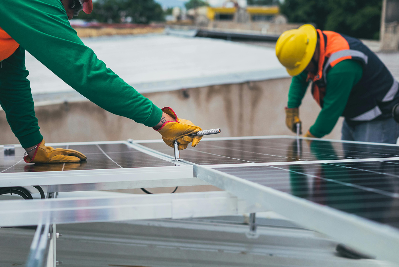 Workers installing solar panels 