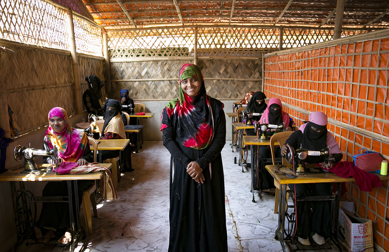 Rohingya women sewing in refugee camp