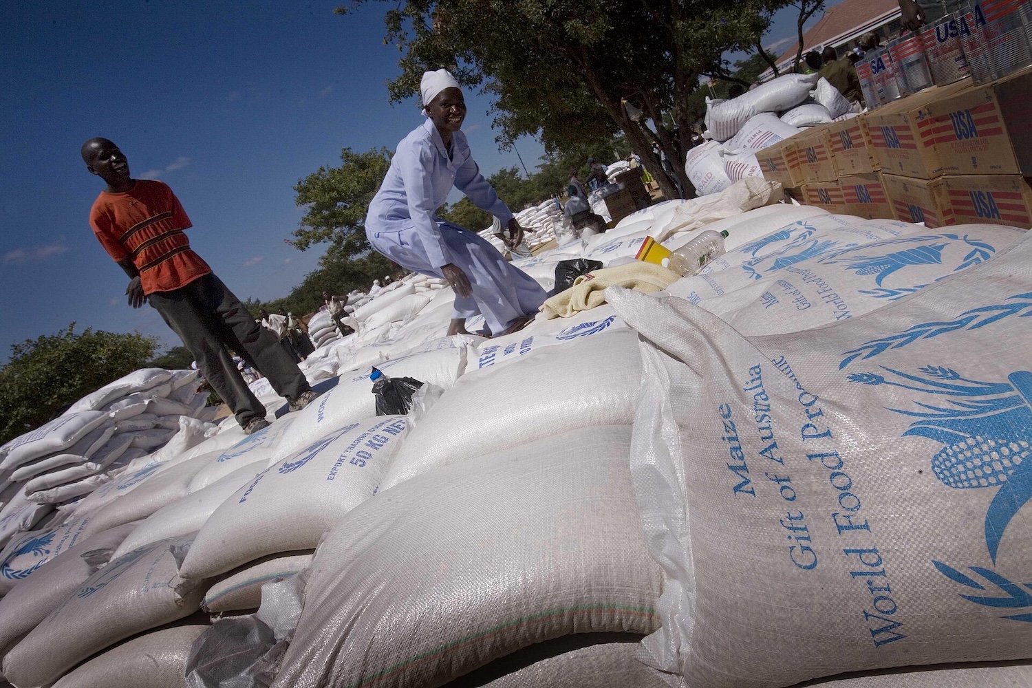 Bags of food aid piled up at a food distribution point
