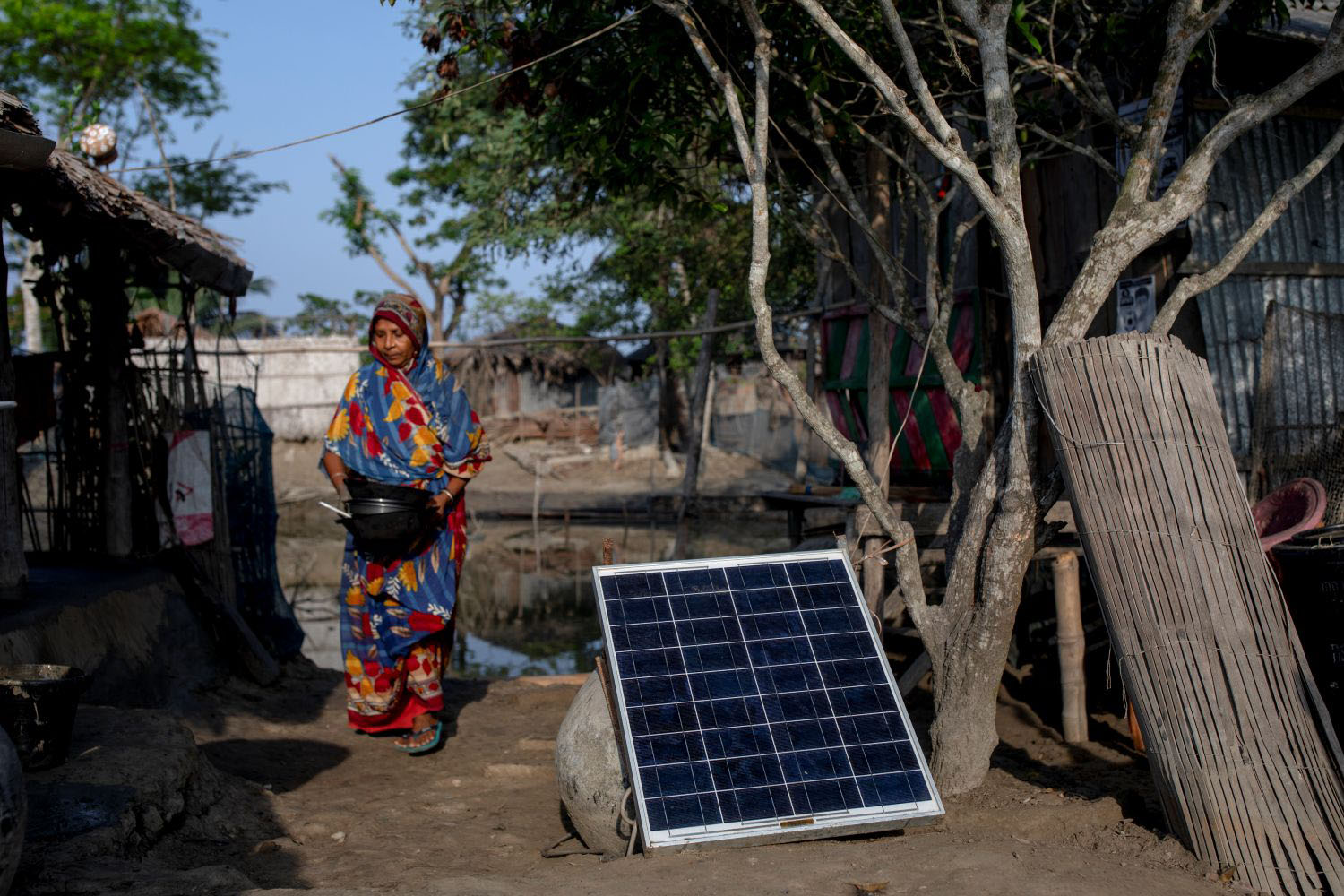 People use solar panels for electricity in the Sundarbans forest area, Bangladesh on April 25, 2021. 