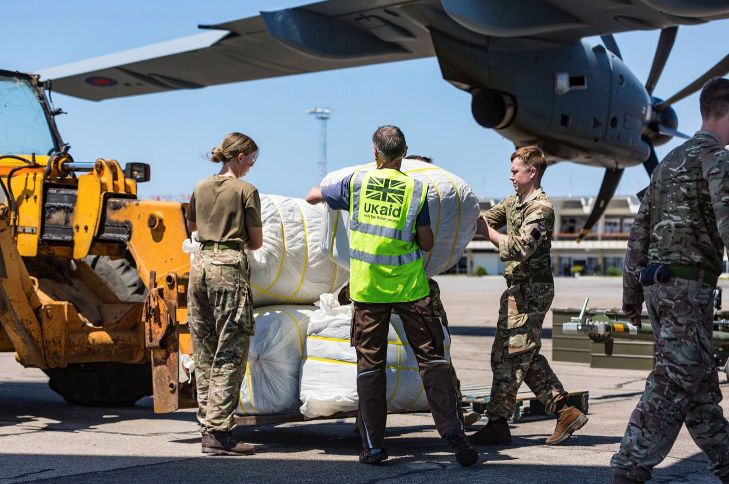 UK aid shelter kits being unloaded from a Royal Air Force A400M flight at Beira airport, Mozambique, for people affected by Cyclone Idai, 26 March 2019