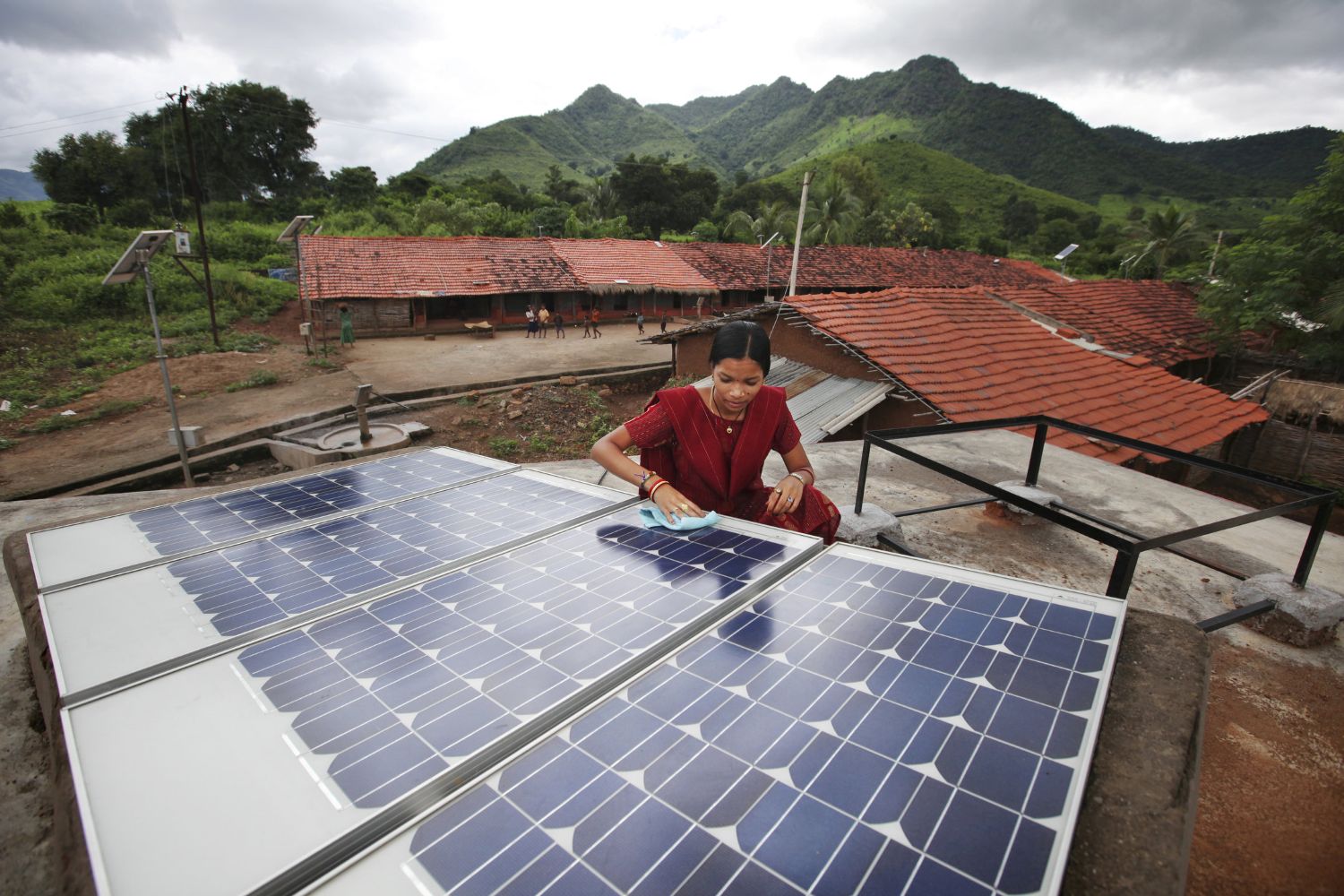 Woman fixing a solar panel