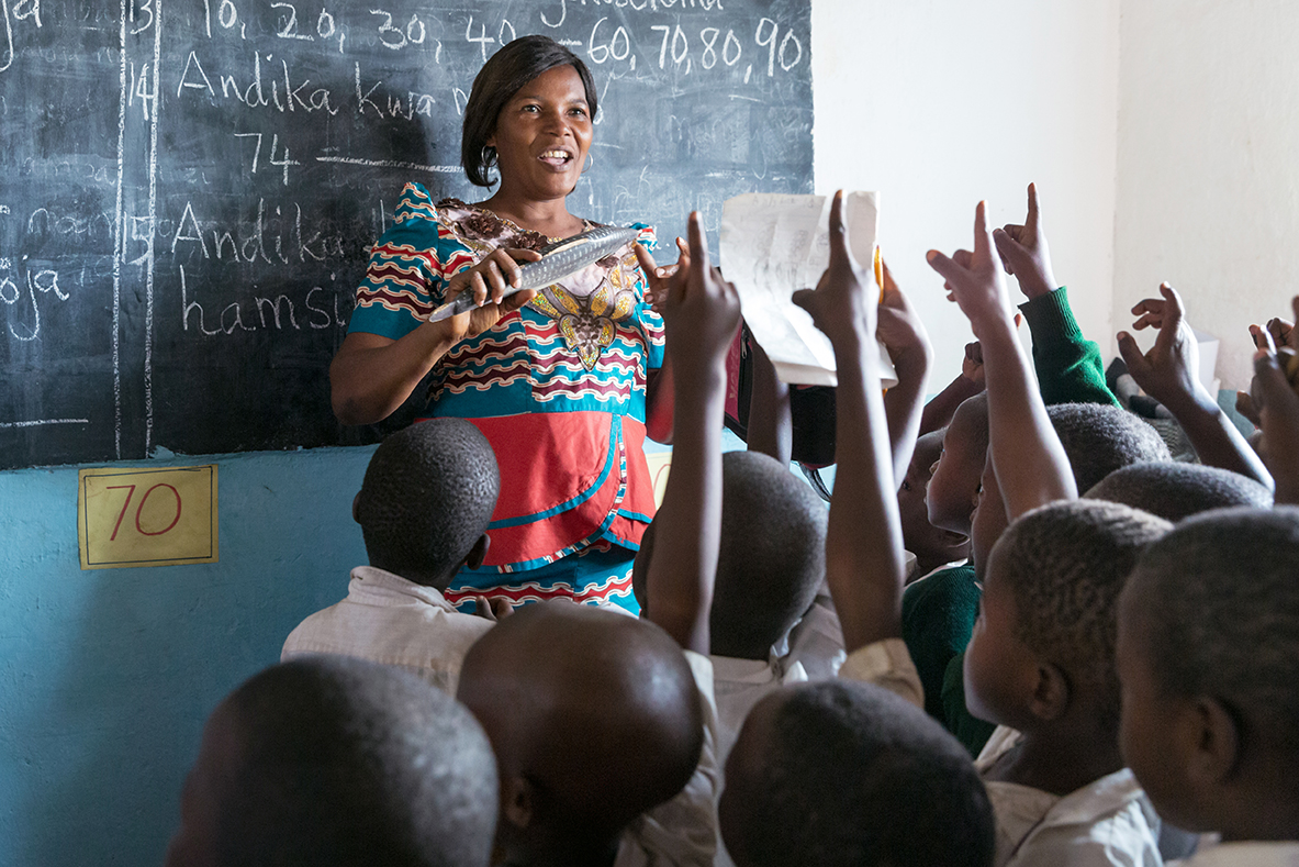 A teacher with her student in class, Tanzania