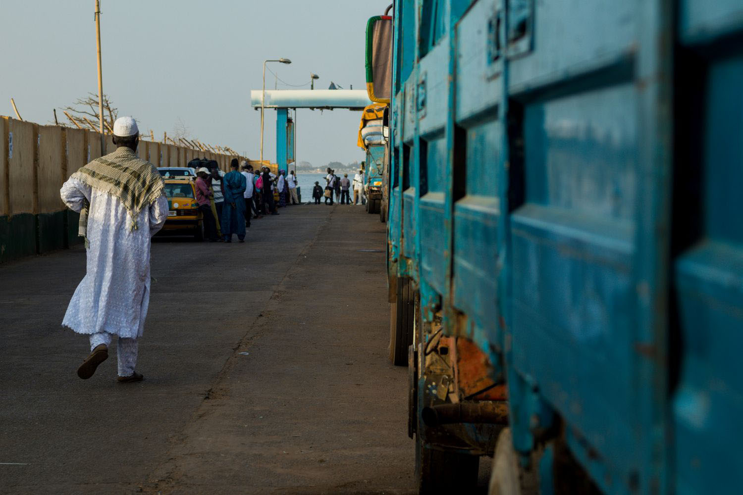 A line of cars and trucks waiting in a queue in ferry terminal in Barra
